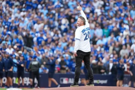 Former Toronto Blue Jays Josh Donaldson throws the first pitch before the game between the Toronto Blue Jays and Seattle Mariners during game two of the ALCS round for the 2025 MLB playoffs at Rogers Centre