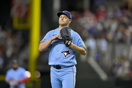 Toronto Blue Jays relief pitcher Paul Sewald (43) walks off the field after hs pitches against the Texas Rangers during the sixth inning at Globe Life Field.