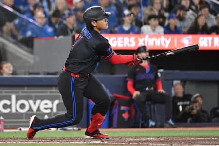 Toronto Blue Jays third baseman Kazuma Okamoto (7) hits a three RBI double against the Cincinnati Reds in the seventh inning at Rogers Centre.