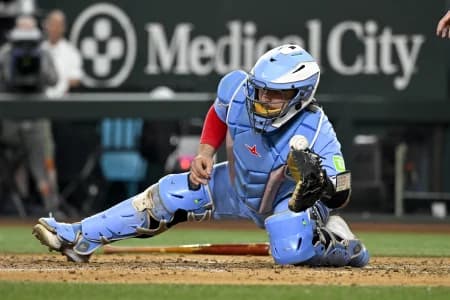 Toronto Blue Jays catcher Alejandro Kirk (30) cannot field the throw to home plate during the sixth inning against the Texas Rangers at Globe Life Field.