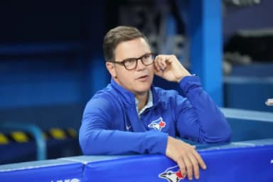 Toronto Blue Jays general manager Ross Atkins talks with the media during batting practice against the San Francisco Giants at Rogers Centre.