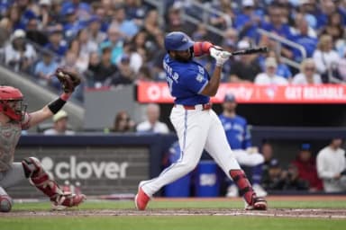 Toronto Blue Jays designated hitter Vladimir Guerrero Jr. (27) strikes out against the Cincinnati Reds during the eighth inning at Rogers Centre.