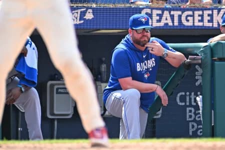 Toronto Blue Jays manager John Schneider (14) looks on from the dugout against the Philadelphia Phillies during the sixth inning at Citizens Bank Park