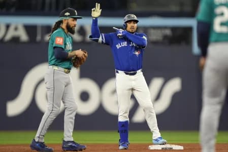 Toronto Blue Jays right fielder Anthony Santander (25) celebrates at second base in the second inning against the Seattle Mariners during game one of the ALCS round for the 2025 MLB playoffs at Rogers Centre