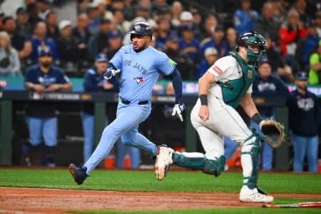 Toronto Blue Jays right fielder Anthony Santander (25) scores on a single from Toronto Blue Jays second baseman Ernie Clement (22) (not pictured) during the fifth inning against the Seattle Mariners during game three of the ALCS round for the 2025 MLB playoffs at T-Mobile Park.