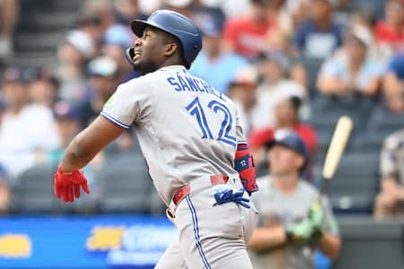 Toronto Blue Jays left fielder Jesus Sanchez (12) hits an RBI single during the fifth inning against the Cleveland Guardians at Progressive Field.
