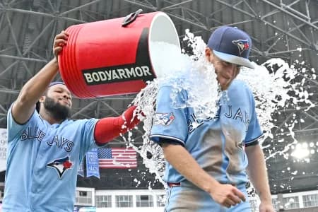 Toronto Blue Jays left fielder Myles Straw (3) gets doused with ice water by first baseman Vladimir Guerrero Jr. (27) as they celebrate a win over the Detroit Tigers at Rogers Centre