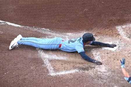 Toronto Blue Jays shortstop Ernie Clement (22) scores a run against the Detroit Tigers in the sixth inning at Rogers Centre.