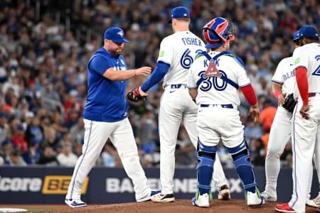 Toronto Blue Jays manager John Schneider (14) relieves starting pitcher Braydon Fisher (63) in the second inning at Rogers Centre.