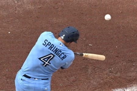 Toronto Blue Jays designated hitter George Springers (4) hits an RBI single against the Detroit Tigers in the fifth inning at Rogers Centre.