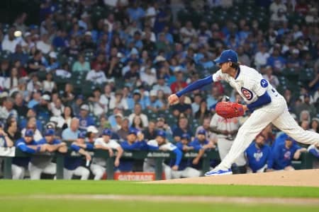 Chicago Cubs pitcher Kevin Gausman (12) throws the ball against the Atlanta Braves during the first inning at Wrigley Field