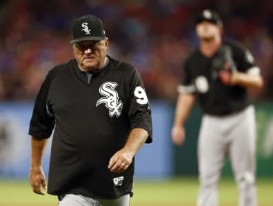 Chicago White Sox pitching coach Don Cooper (99) walks back to the dugout after a conference with relief pitcher Dylan Covey during a baseball game against the Texas Rangers at Globe Life Park in Arlington.