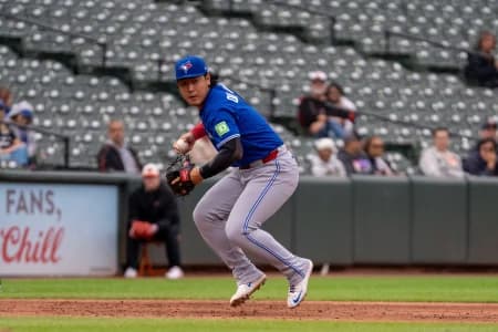 Toronto Blue Jays infielder Kazuma Okamoto (7) fields a ground ball during the seventh inning at Oriole Park at Camden Yards.