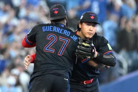 Toronto Blue Jays third baseman Kazuma Okamoto (7) celebrates with first baseman Vladimir Guerrero Jr. (27) after a win over the Cincinnati Reds at Rogers Centre.