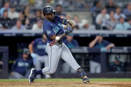 Seattle Mariners left fielder Randy Arozarena (56) hits a solo home run against the New York Yankees during the sixth inning at Yankee Stadium.