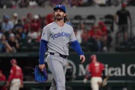 Toronto Blue Jays pitcher Dylan Cease (84) walks off the field after giving up four runs to the Texas Rangers during the second inning at Globe Life Field. M