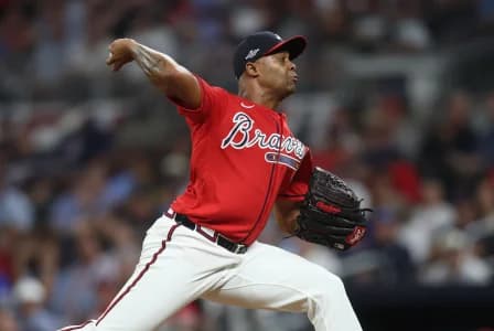 Atlanta Braves pitcher Raisel Iglesias (26) pitches against the Los Angeles Dodgers during the ninth inning at Truist Park.