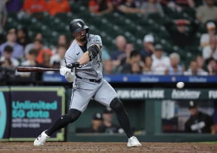 Chicago White Sox designated hitter Randal Grichuk (34) hits an RBI double during the seventh inning against the Houston Astros at Daikin Park