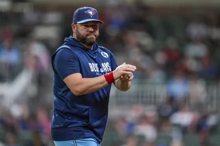 Toronto Blue Jays manager John Schneider (14) on the field against the Atlanta Braves during the eighth inning at Truist Park