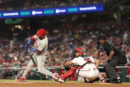 Philadelphia Phillies second baseman Luis Arraez (4) hits an RBI double against the Washington Nationals during the third inning at Nationals Park.