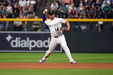 Colorado Rockies infielder Ezequiel Tovar (14) throws to first for an out in the first inning against the Seattle Mariners at Coors Field.