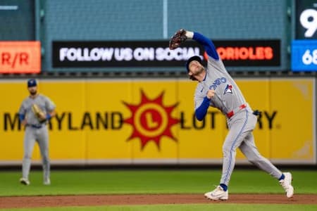 Toronto Blue Jays infielder Ernie Clement (22) catches an infield fly during the eighth inning at Oriole Park at Camden Yards.
