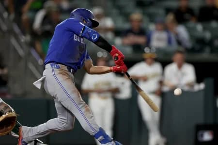 Toronto Blue Jays short stop Andres Gimenez (0) hits a solo home against Athletics pitcher Hogan Harris (not pictured) during the ninth inning at Sutter Health Park.