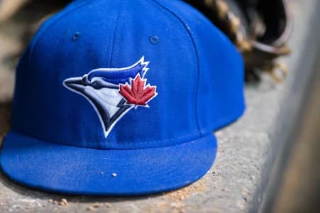 A view of a Toronto Blue Jays ball cap and logo during the game between the Texas Rangers and the Blue Jays at Globe Life Park in Arlington. The Blue Jays shut out the Rangers 2-0.
